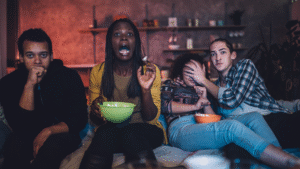 Person watching a screen with a shocked and confused expression — perfect reaction for WTF movies to watch tonight